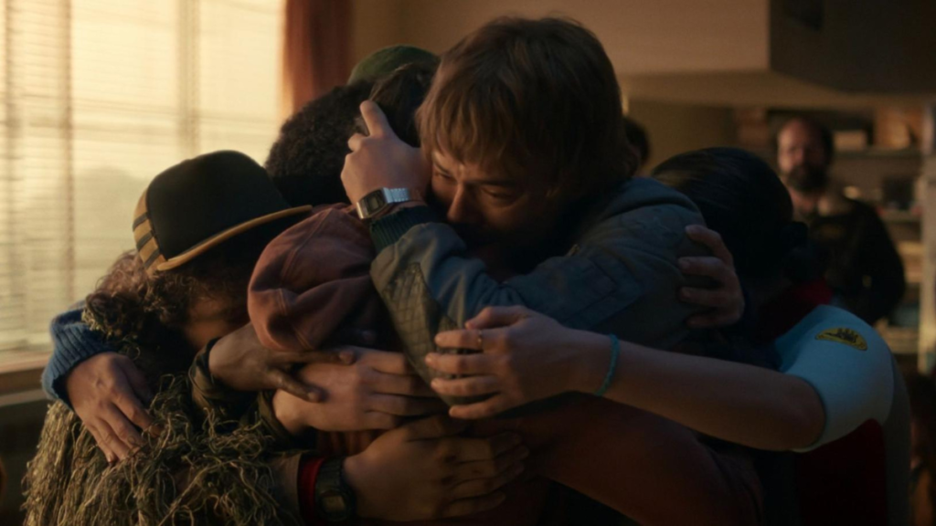 Will's confession is greeted with a tearful hug from Jonathan, Joyce, Eleven, Mike, Lucas and Dustin